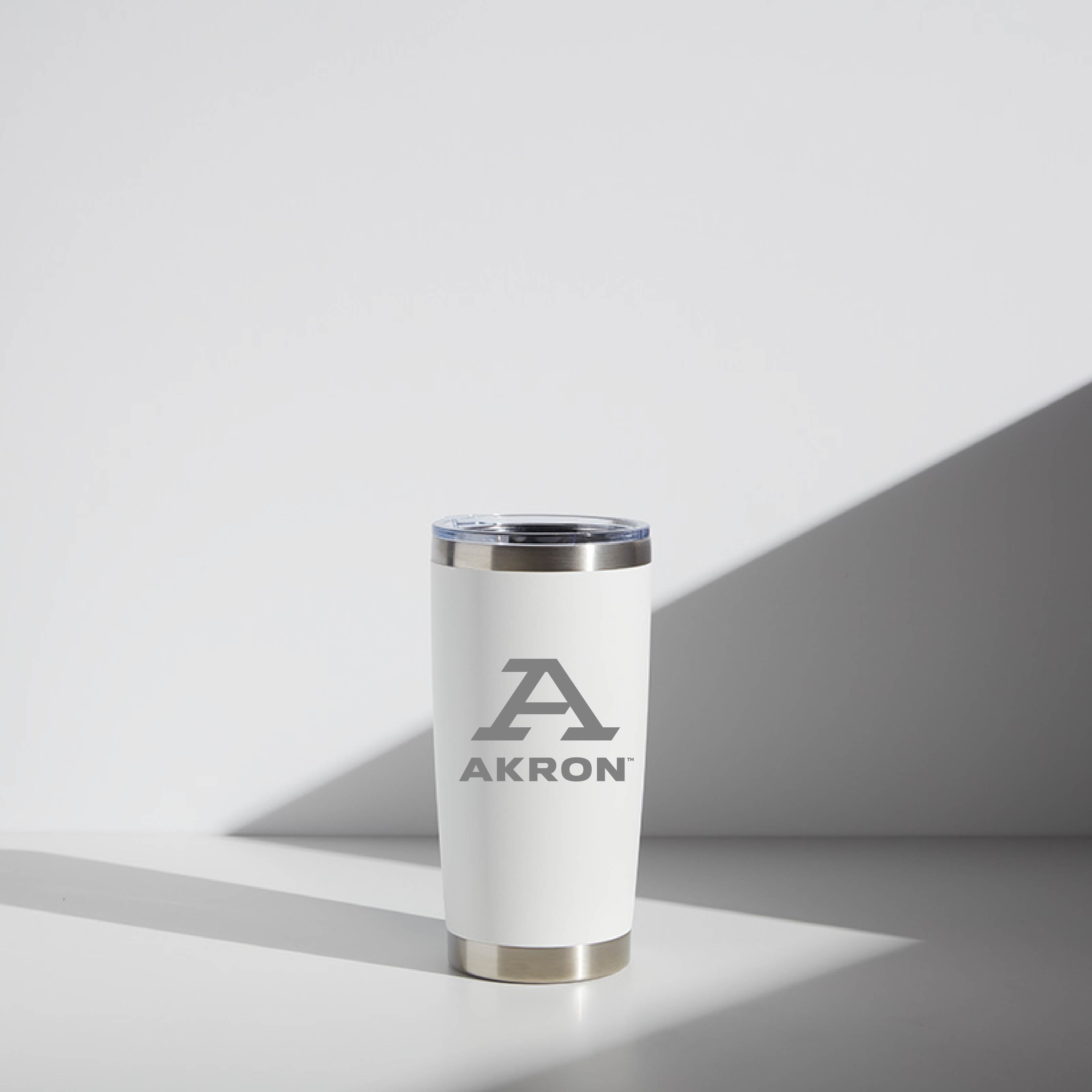 20 oz WATR tumbler featuring the University of Akron logo with a block 'A' design, stainless steel rim, and white body, displayed in soft, natural lighting.