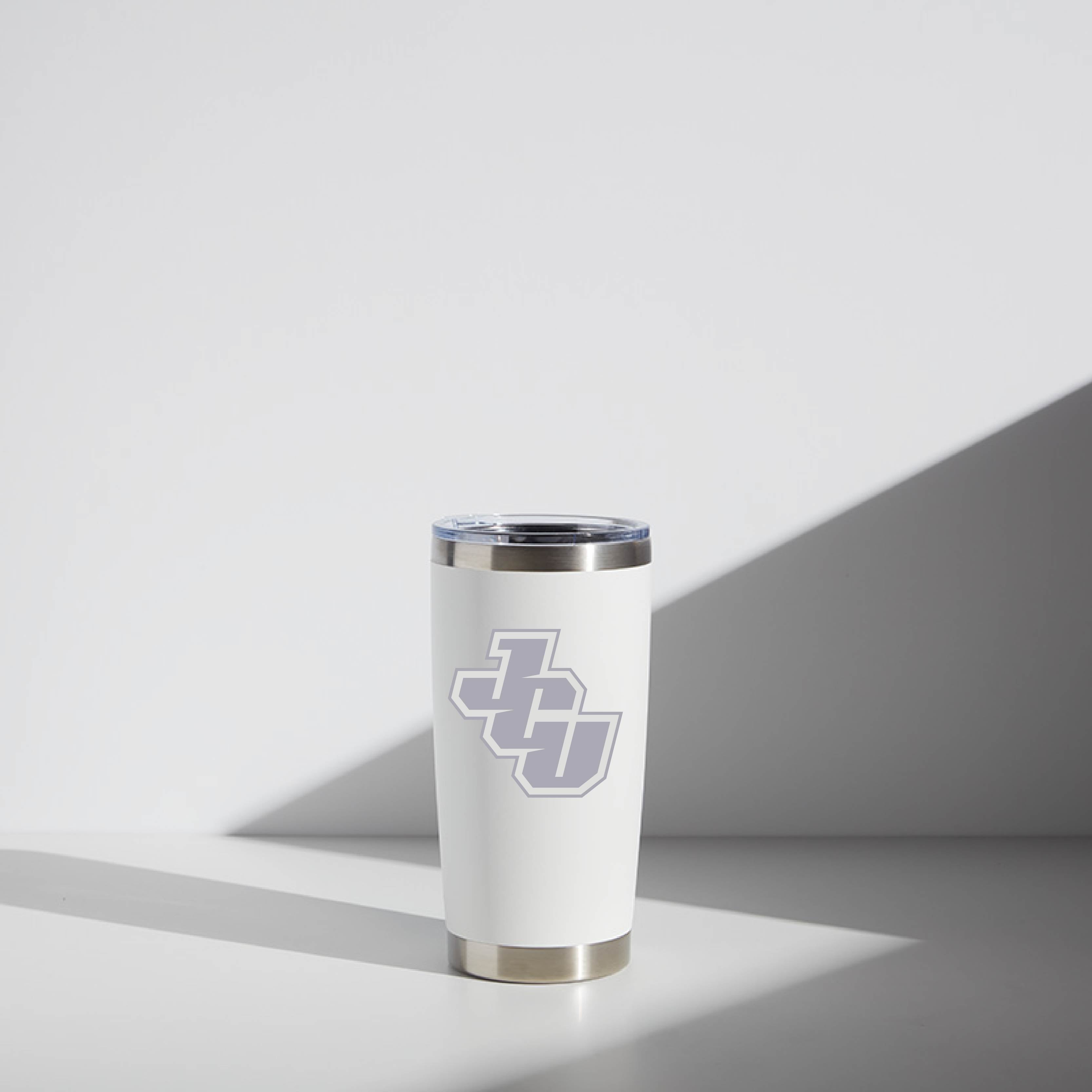 Alt text: "20 oz WATR brand stainless steel tumbler in white, featuring John Carroll University (JCU) logo, situated on a minimalist background with soft shadows."