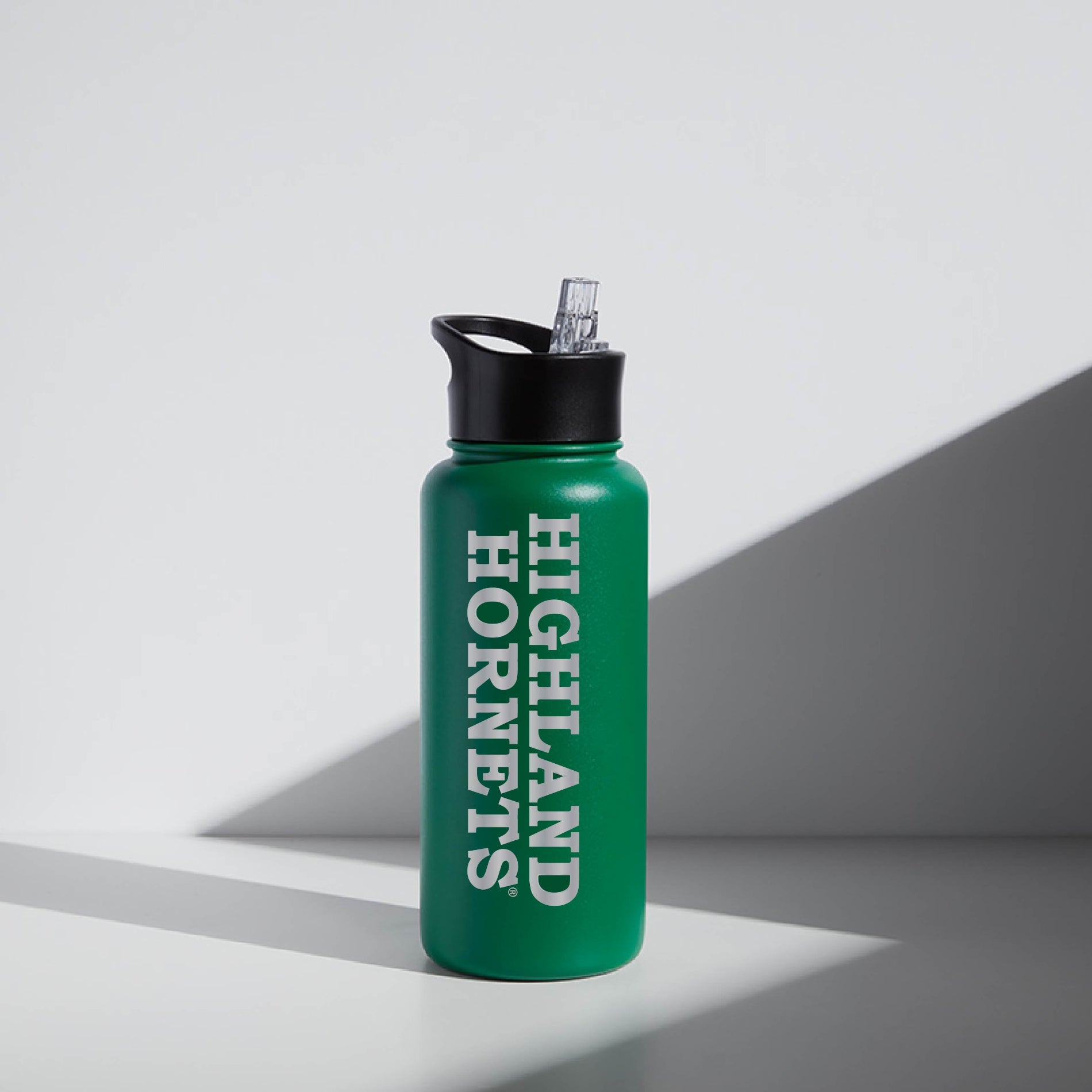 Green custom water bottle for school fundraisers with gray background