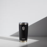 Alt text: "A 20 oz WATR Tumbler in black with a silver rim and clear lid, featuring a white minimalist wave logo above the brand name 'watr' in white lowercase letters, set against a softly lit background with