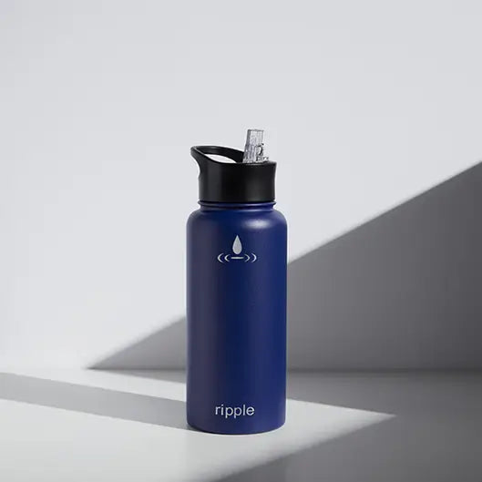 Custom navy blue Ripple insulated tumbler with black sport lid, engraved with a water drop logo, for realtor closing gifts